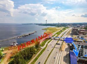 an aerial view of a city with a river and a bridge at Spacious loft apartment with a lake view in Tampere
