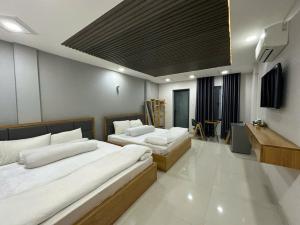 Postel nebo postele na pokoji v ubytování Hotel & Homestay LABUBU + 25 fotografií
