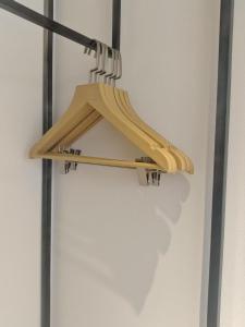 a wooden shelf hanging on a wall at Atour Hotel Hefei Jingshang Commercial City North Tongling Road in Hefei