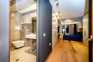 a bathroom with a toilet and a sink in a room at Sofia Luxury 3-Bed Penthouse Apartment Sleeps 6 in Sofia +43 photos