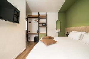 Posteľ alebo postele v izbe v ubytovaní Hotel Oasi Verde