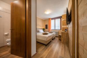 Posteľ alebo postele v izbe v ubytovaní Hotel Oasi Verde