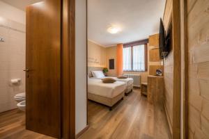 Posteľ alebo postele v izbe v ubytovaní Hotel Oasi Verde