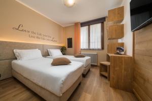 Posteľ alebo postele v izbe v ubytovaní Hotel Oasi Verde + 37 fotografií