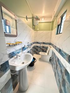 Koupelna v ubytování Maple Homestay + 37 fotografií