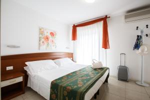Letto o letti in una camera di Hotel Ada