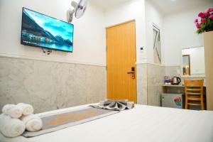 Postel nebo postele na pokoji v ubytování Nghia Lan Hotel