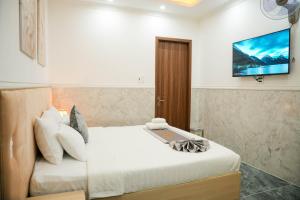 Postel nebo postele na pokoji v ubytování Nghia Lan Hotel