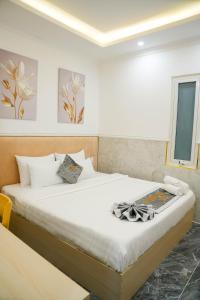 Postel nebo postele na pokoji v ubytování Nghia Lan Hotel