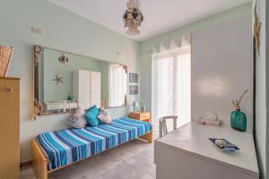 A bed or beds in a room at Una Araucaria sul mare