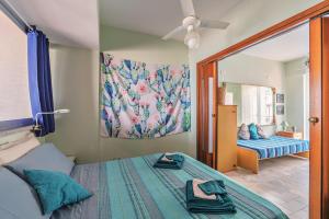 A bed or beds in a room at Una Araucaria sul mare