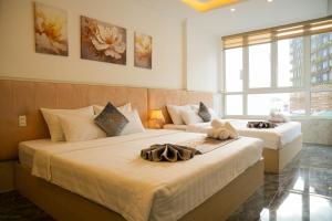 Postel nebo postele na pokoji v ubytování Nghia Lan Hotel