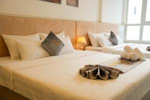 Postel nebo postele na pokoji v ubytování Nghia Lan Hotel