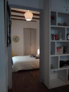 a bedroom with a bed and a light in a doorway at Valencia what else... in Valencia
