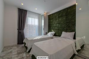 a bedroom with two beds and a window at Charming Villa with a Pool in Alanya +77 photos