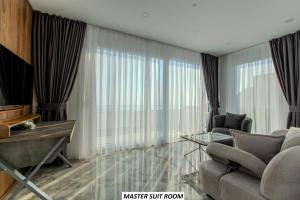a living room with a couch and a table at Charming Villa with a Pool in Alanya
