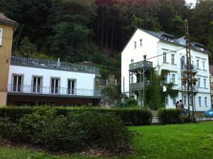 two large white buildings next to each other at Apartmenthaus Saxonia in Bad Schandau