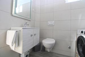 Koupelna v ubytování Apartment Dragomir 1052