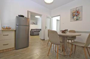 Kuchyň nebo kuchyňský kout v ubytování Apartment Dragomir 1052