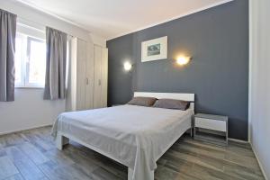 Postel nebo postele na pokoji v ubytování Apartment Dragomir 1052