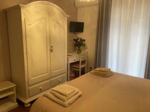 Łóżko lub łóżka w pokoju w obiekcie Bed & Breakfast con vista giardino e piscina