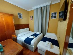 Postel nebo postele na pokoji v ubytování Hotel Positano 2 MIMOSA