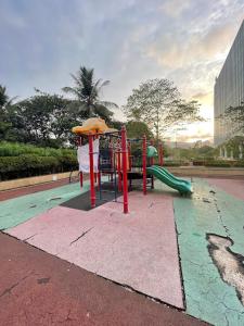 a playground with a slide in a park at Aarya Stays- 1BHK near Jupiter Hospital in Thane