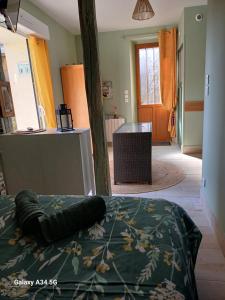 a bed with a pillow on it in a room at L'intervalle des 18 châteaux in Saint-Georges-sur-Cher