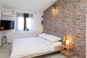 Postel nebo postele na pokoji v ubytování Ananas Apartments
