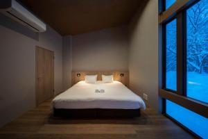 Rúm í herbergi á Chalet Infinity