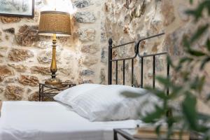 A bed or beds in a room at Stratis Tower since 1892