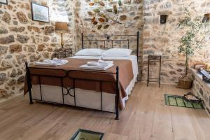 A bed or beds in a room at Stratis Tower since 1892