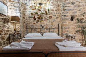 A bed or beds in a room at Stratis Tower since 1892