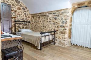 A bed or beds in a room at Stratis Tower since 1892