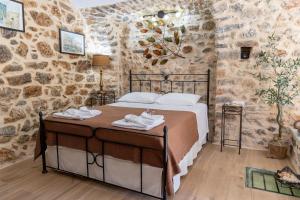 A bed or beds in a room at Stratis Tower since 1892