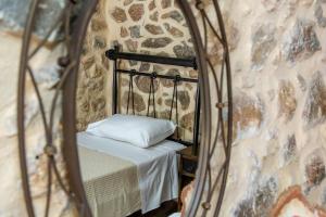 A bed or beds in a room at Stratis Tower since 1892