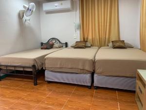 Postel nebo postele na pokoji v ubytování Patcharin Home Stay