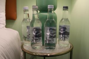 a group of four bottles of water on a table at Sunday Street Boutique in Drogheda