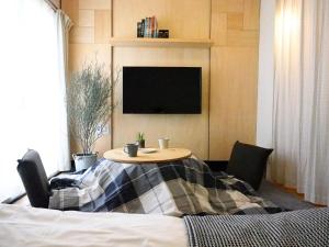 TV a/nebo společenská místnost v ubytování Guesthouse Life Field