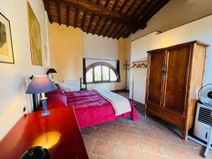 a bedroom with a large bed and a window at Villa 9P, 3BdR Chianti, near Florence and Siena in Barberino di Val dʼElsa