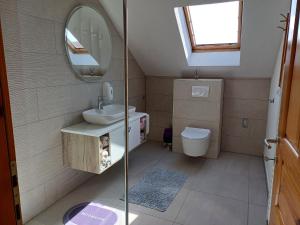 a small bathroom with a sink and a mirror at Lavanda farm apartmani in Rakovica +69 photos