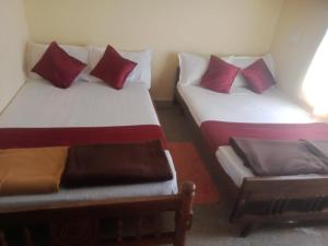 Postel nebo postele na pokoji v ubytování PRASHANTH Home Stay