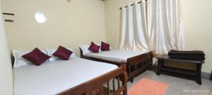 Postel nebo postele na pokoji v ubytování PRASHANTH Home Stay
