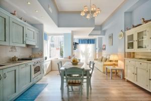 A kitchen or kitchenette at La Bouganville Holiday House