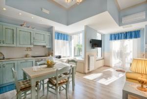 A kitchen or kitchenette at La Bouganville Holiday House