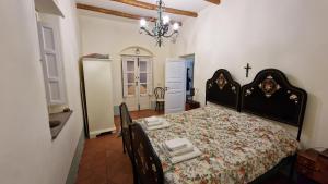 Posteľ alebo postele v izbe v ubytovaní La Casa del Mandorlo