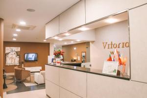 TV a/nebo společenská místnost v ubytování Vitoria Hotel