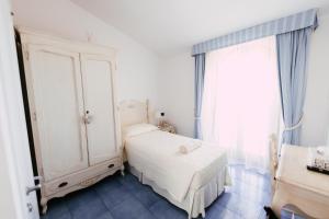 Postel nebo postele na pokoji v ubytování Baia Delphis Resort
