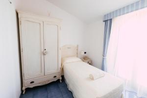Postel nebo postele na pokoji v ubytování Baia Delphis Resort