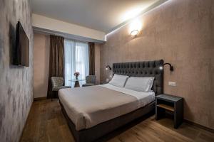 Postel nebo postele na pokoji v ubytování Florence Old Bridge B&B